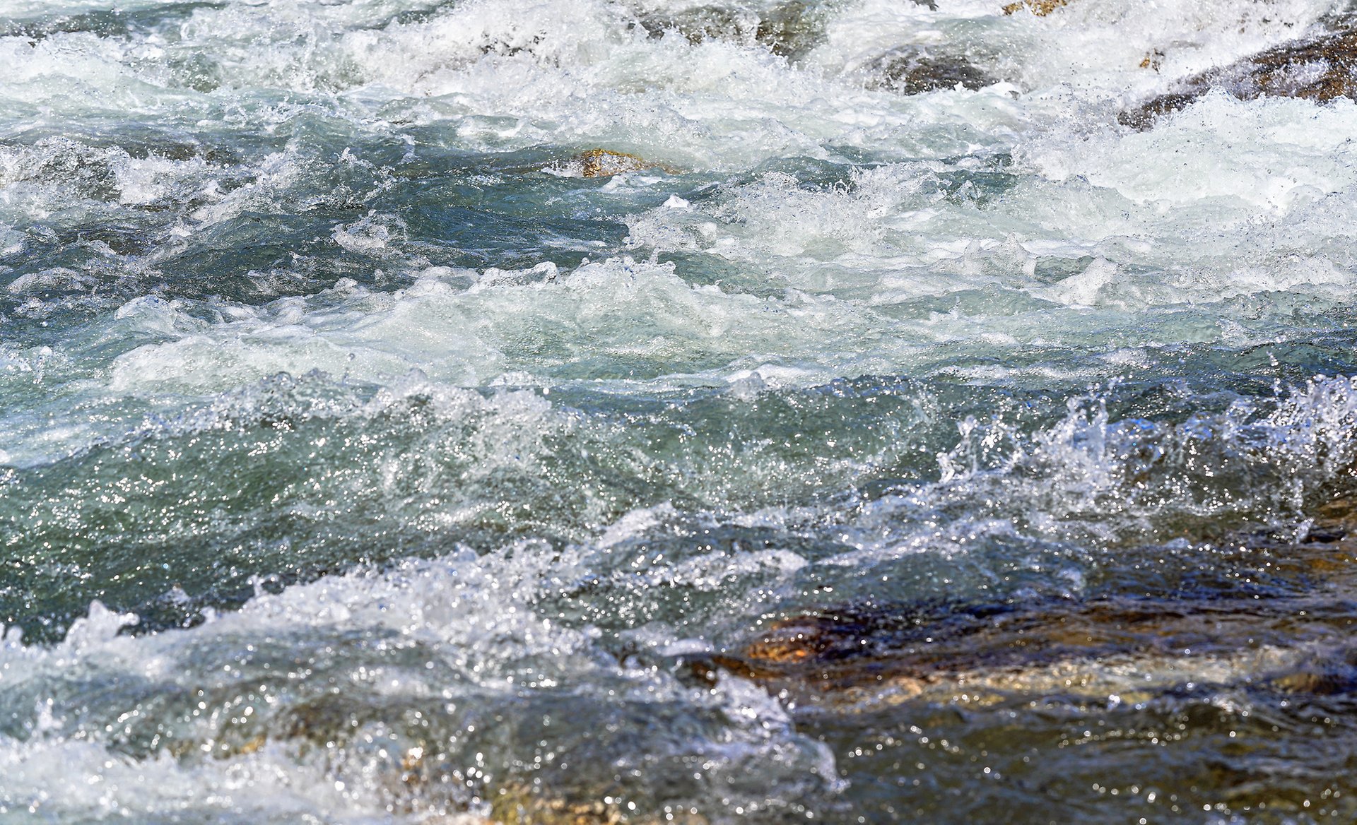 mp69408898-rapid-spring-river-flowing-over-rocks-on-sunny-day.jpg
